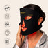 Woman wearing the Madam Glam Glam Aura LED Light Therapy Mask with red light illuminating her face, shown with FDA cleared, non-invasive, safe for all skin types, and 10-minute daily use icons